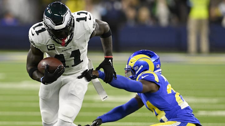 Nov 24, 2024; Inglewood, California, USA;  Philadelphia Eagles wide receiver A.J. Brown (11) spins away from Los Angeles Rams cornerback Darious Williams (24) after a catch-and-run during the first half at SoFi Stadium. Mandatory Credit: Alex Gallardo-Imagn Images