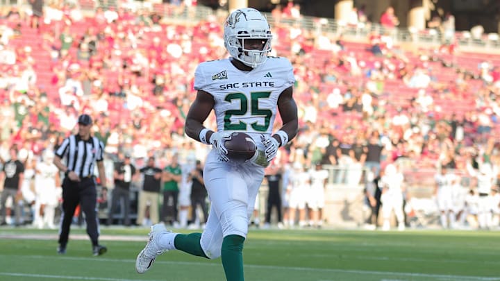 Sep 16, 2023; Stanford, California, USA; Sacramento State Hornets running back Elijah Tau-Tolliver (25) scores a touchdown during the second quarter against the Stanford Cardinal at Stanford Stadium. Mandatory Credit: Sergio Estrada-Imagn Images
