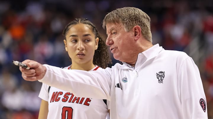 Mar 9, 2025; Greensboro, NC, USA; NC State Wolfpack head coach Wes Moore talks with NC State Wolfpack guard Devyn Quigley (0) during the fourth quarter against Duke Blue Devils at First Horizon Coliseum. Mandatory Credit: Cory Knowlton-Imagn Images Mar 9, 2025; Greensboro, NC, USA; NC State Wolfpack head coach Wes Moore talks with NC State Wolfpack guard Devyn Quigley (0) during the fourth quarter against Duke Blue Devils at First Horizon Coliseum. Mandatory Credit: Cory Knowlton-Imagn Images