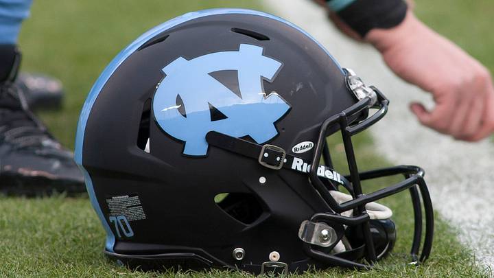 Dec 28, 2013; Charlotte, NC, USA; A North Carolina Tar Heels helmet lays on the field prior to the start of the game against the Cincinnati Bearcats in the Belk Bowl at Bank of America Stadium. Mandatory Credit: Jeremy Brevard-USA TODAY Sports Dec 28, 2013; Charlotte, NC, USA; A North Carolina Tar Heels helmet lays on the field prior to the start of the game against the Cincinnati Bearcats in the Belk Bowl at Bank of America Stadium. Mandatory Credit: Jeremy Brevard-USA TODAY Sports