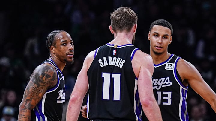Jan 10, 2025; Boston, Massachusetts, USA; Sacramento Kings forward DeMar DeRozan (10), forward Keegan Murray (13) and forward Domantas Sabonis (11) react after defeating the Boston Celtics at TD Garden.