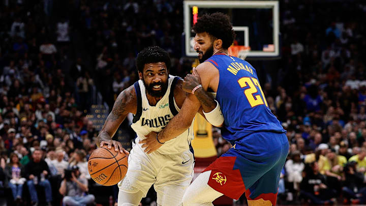 Nov 22, 2024; Denver, Colorado, USA; Dallas Mavericks guard Kyrie Irving (11) drives to the basket against Denver Nuggets guard Jamal Murray (27) in the third quarter at Ball Arena. Mandatory Credit: Isaiah J. Downing-Imagn Images