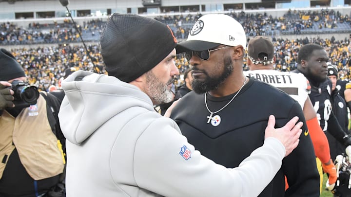 Jan 8, 2023; Pittsburgh, Pennsylvania, USA;  Cleveland Browns head coach Kevin Stefanski (left) meets with Pittsburgh Steelers head coach Mike Tomlin after a Steelers 28-14 win at Acrisure Stadium. Mandatory Credit: Philip G. Pavely-Imagn Images