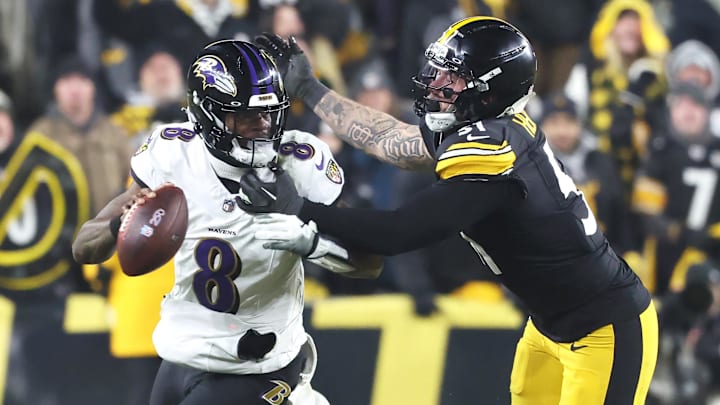 Jan 4, 2026; Pittsburgh, Pennsylvania, USA; Baltimore Ravens quarterback Lamar Jackson (8) scrambles with the ball as Pittsburgh Steelers linebacker Nick Herbig (51) cases during the fourth quarter at Acrisure Stadium. Mandatory Credit: Charles LeClaire-Imagn Images Jan 4, 2026; Pittsburgh, Pennsylvania, USA; Baltimore Ravens quarterback Lamar Jackson (8) scrambles with the ball as Pittsburgh Steelers linebacker Nick Herbig (51) cases during the fourth quarter at Acrisure Stadium. Mandatory Credit: Charles LeClaire-Imagn Images
