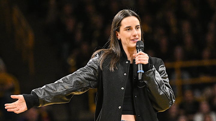 Feb 2, 2025; Iowa City, Iowa, USA; Former Iowa Hawkeyes player Caitlin Clark speaks after the game at Carver-Hawkeye Arena against the USC Trojans. The Hawkeyes retired Clark’s jersey after the game. Mandatory Credit: Jeffrey Becker-Imagn Images