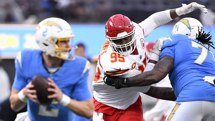Jan 7, 2024; Inglewood, California, USA; Kansas City Chiefs defensive tackle Chris Jones (95) is blocked by Los Angeles Chargers guard Jordan McFadden (71) during the first half at SoFi Stadium. Mandatory Credit: Orlando Ramirez-USA TODAY Sports