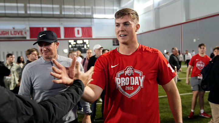 Ohio State Buckeyes quarterback Will Howard gets high fives following his pro day for NFL scouts at the Woody Hayes Athletic Center on March 26, 2025. Ohio State Buckeyes quarterback Will Howard gets high fives following his pro day for NFL scouts at the Woody Hayes Athletic Center on March 26, 2025.