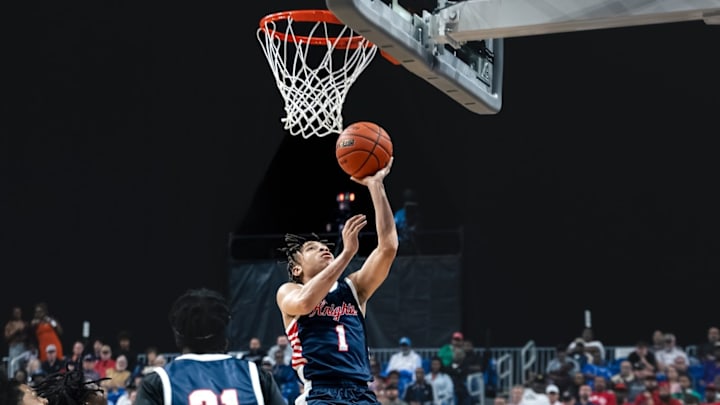 Dallas Justin F. Kimball's Rylan Austin goes up for a layup against Rosharon Almeta Crawford in the Class 4A Division 1 finals on Friday in San Antonio.