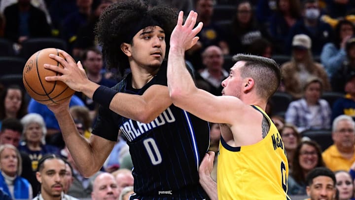 Orlando Magic guard Anthony Black (0) looks to get a ball past Indiana Pacers guard T.J. McConnell (9) during the second half at Gainbridge Fieldhouse. Mandatory Credit: Marc Lebryk-Imagn Images Orlando Magic guard Anthony Black (0) looks to get a ball past Indiana Pacers guard T.J. McConnell (9) during the second half at Gainbridge Fieldhouse. Mandatory Credit: Marc Lebryk-Imagn Images
