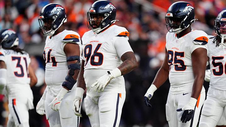 Denver Broncos defensive tackle Jordan Jackson (94) and defensive end Eyioma Uwazurike (96) and defensive end Sai'vion Jones (95) at the line of scrimmage in the first quarter against the Arizona Cardinals.