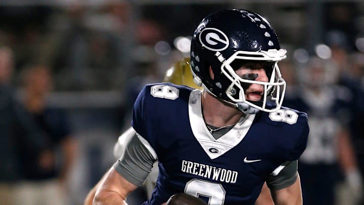 Greenwood's Kane Archer is chased out of the pocket by a Pulaski Academy defender while looking for a receiver during the 5A West Conference game on Oct. 28 at Smith Robinson Stadium.

Greenwood Pul Acad Fb 102822 04