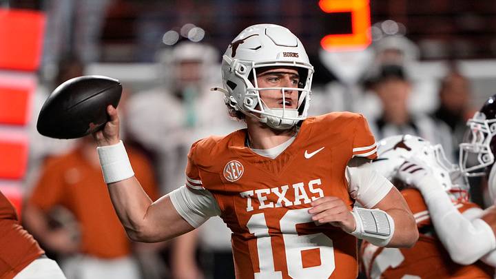 Texas Longhorns quarterback Arch Manning throws a pass during the first half against the Texas A&M Aggies at Darrell K Royal-Texas Memorial Stadium. Texas Longhorns quarterback Arch Manning throws a pass during the first half against the Texas A&M Aggies at Darrell K Royal-Texas Memorial Stadium.