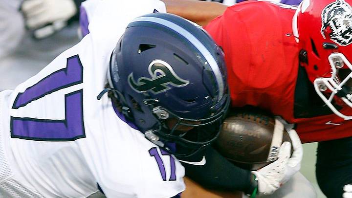 Fayetteville's Trey Lisle (17) and Ramses Capers (48) bring down Northside's T'kavion King (2) during a nonconference game in Fort Smith on Sept. 9 at Mayo-Thompson Stadium. Fayetteville's Trey Lisle (17) and Ramses Capers (48) bring down Northside's T'kavion King (2) during a nonconference game in Fort Smith on Sept. 9 at Mayo-Thompson Stadium.