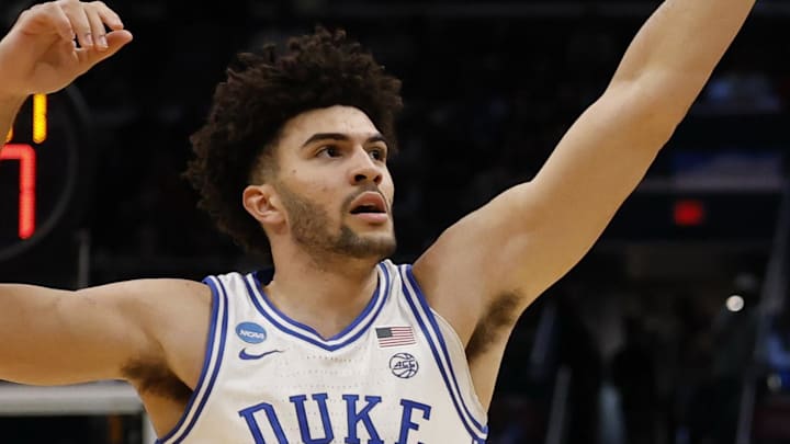 Mar 29, 2026; Washington, DC, USA; UConn Huskies forward Alex Karaban (11) shoots the ball over Duke Blue Devils forward Cameron Boozer (12) during an Elite Eight game of the East Regional of the men's 2026 NCAA Tournament at Capital One Arena. Mandatory Credit: Geoff Burke-Imagn Images