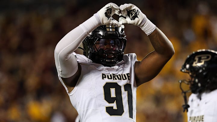 Purdue Boilermakers defensive lineman CJ Nunnally (91) gestures toward the crowd 