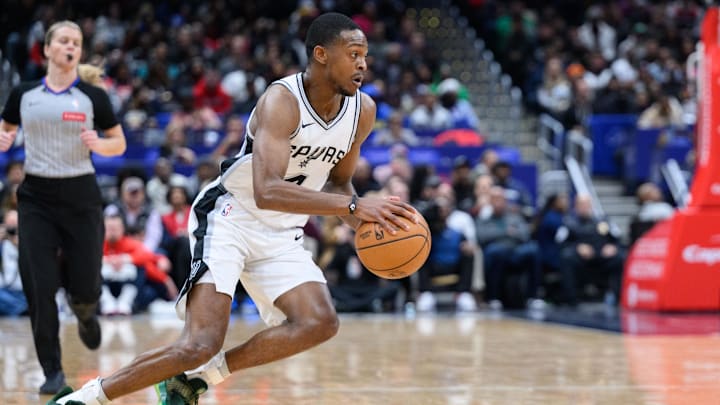 Feb 10, 2025; Washington, District of Columbia, USA; San Antonio Spurs guard De'Aaron Fox (4) handles the ball during the third quarter against the Washington Wizards at Capital One Arena.