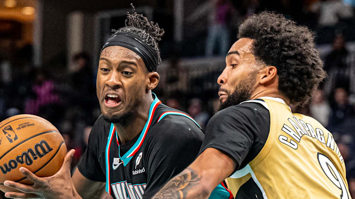 Memphis Grizzlies forward Oliver-Maxence Prosper drives into defender Washington Wizards Forward Justin Champagnie.