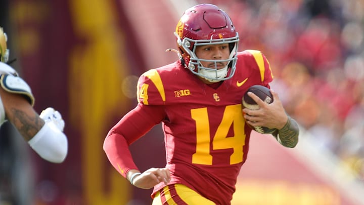 Nov 30, 2024; Los Angeles, California, USA; Southern California Trojans quarterback Jayden Maiava (14) runs the ball against the Notre Dame Fighting Irish during the first half at the Los Angeles Memorial Coliseum. Nov 30, 2024; Los Angeles, California, USA; Southern California Trojans quarterback Jayden Maiava (14) runs the ball against the Notre Dame Fighting Irish during the first half at the Los Angeles Memorial Coliseum.