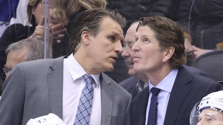 Mar 11, 2019; Toronto, Ontario, CAN; Toronto Maple Leafs assistant coach Jim Hiller talks to head coach Mike Babcock on the bench in the third period against the Tampa Bay Lightning at Scotiabank Arena. The Lightning beat the Maple Leafs 6-2. Mandatory Credit: Tom Szczerbowski-Imagn Images Mar 11, 2019; Toronto, Ontario, CAN; Toronto Maple Leafs assistant coach Jim Hiller talks to head coach Mike Babcock on the bench in the third period against the Tampa Bay Lightning at Scotiabank Arena. The Lightning beat the Maple Leafs 6-2. Mandatory Credit: Tom Szczerbowski-Imagn Images