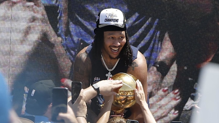 Jun 24, 2025; Oklahoma City, OK, USA; Oklahoma City Thunder forward Jaylin Williams lets fans touch the Larry O'Brien Championship Trophy during the Oklahoma City Thunder Champions parade. Center. Mandatory Credit: Alonzo Adams-Imagn Images