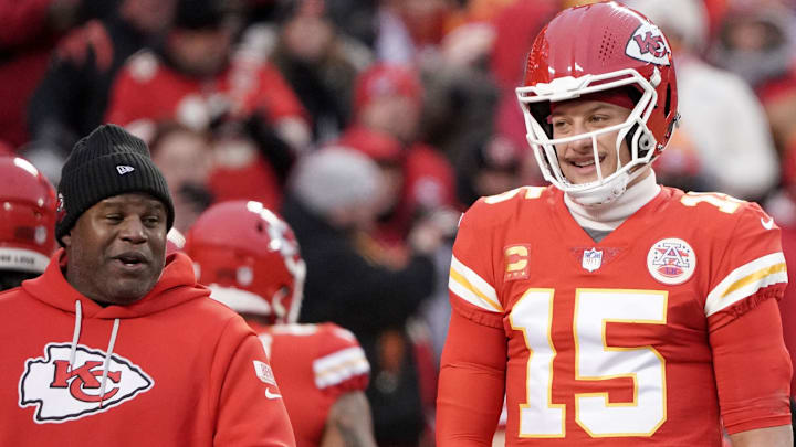 Jan 29, 2023; Kansas City, Missouri, USA; Kansas City Chiefs offensive coordinator Eric Bieniemy talks with quarterback Patrick Mahomes (15) against the Cincinnati Bengals prior to the AFC Championship game at GEHA Field at Arrowhead Stadium. Mandatory Credit: Denny Medley-Imagn Images