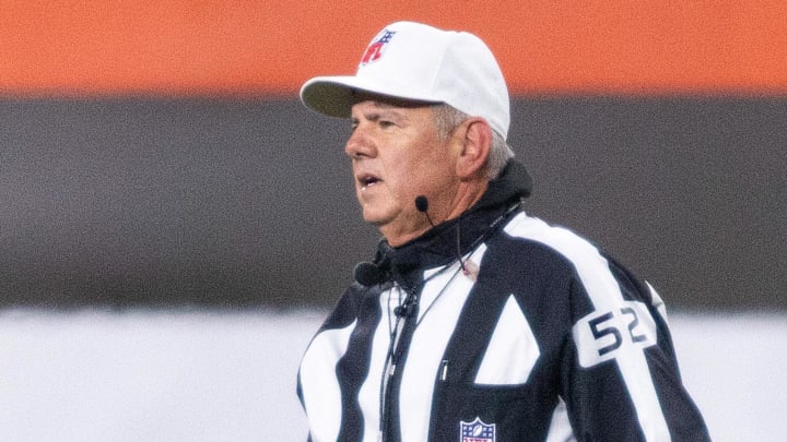 Dec 14, 2020; Cleveland, Ohio, USA; NFL referee Bill Vinovich (52) announces a replay review during the third quarter between the Cleveland Browns and the Baltimore Ravens at FirstEnergy Stadium.