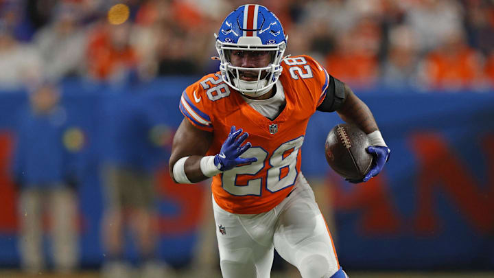 Jan 4, 2026; Denver, Colorado, USA; Denver Broncos running back Tyler Badie (28) runs with the ball during the fourth quarter against the Los Angeles Chargers at Empower Field at Mile High. Mandatory Credit: Isaiah J. Downing-Imagn Images