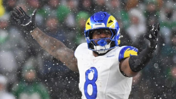 Jan 19, 2025; Philadelphia, Pennsylvania, USA; Los Angeles Rams linebacker Jared Verse (8) and linebacker Byron Young (0) celebrate a sack against the Philadelphia Eagles in a 2025 NFC divisional round game at Lincoln Financial Field. Mandatory Credit: Eric Hartline-Imagn Images