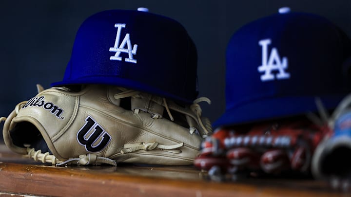 Jul 30, 2025; Cincinnati, Ohio, USA; A general view of a Los Angeles Dodgers hat and glove during the second inning in the game against the Cincinnati Reds at Great American Ball Park.