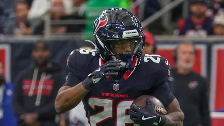 Dec 14, 2025; Houston, Texas, USA; Houston Texans running back Jawhar Jordan (26) breaks the tackle of Arizona Cardinals defensive tackle Dalvin Tomlinson (94) in the first quarter at NRG Stadium. Dec 14, 2025; Houston, Texas, USA; Houston Texans running back Jawhar Jordan (26) breaks the tackle of Arizona Cardinals defensive tackle Dalvin Tomlinson (94) in the first quarter at NRG Stadium.