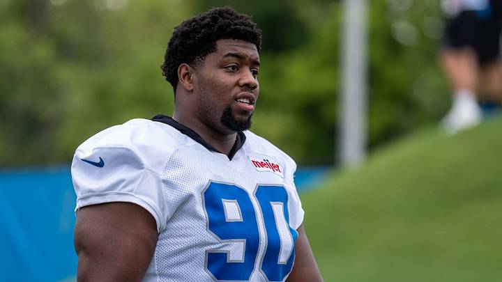 Detroit Lions defensive lineman Chris Smith (90) walks off the field following training camp practice. Detroit Lions defensive lineman Chris Smith (90) walks off the field following training camp practice.