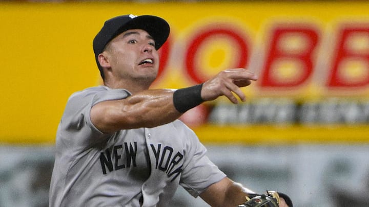 Aug 16, 2025; St. Louis, Missouri, USA;  New York Yankees shortstop Anthony Volpe (11) throws on the run and forces out St. Louis Cardinals third baseman Nolan Gorman (not pictured) during the eighth inning at Busch Stadium. Mandatory Credit: Jeff Curry-Imagn Images