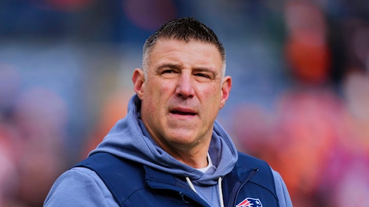 Mike Vrabel of the New England Patriots stands on the sidelines