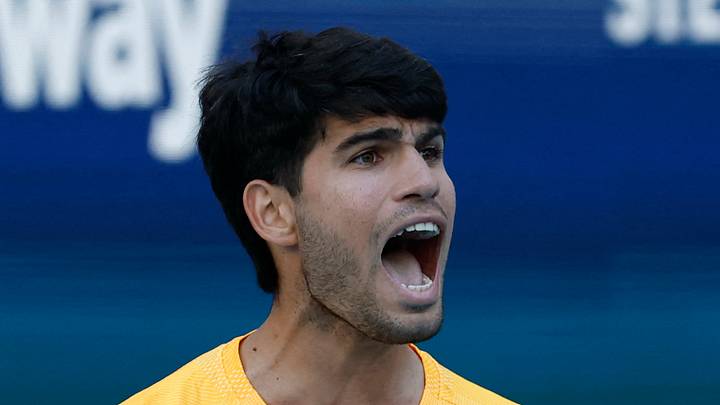 Carlos Alcaraz reacts after winning a game
