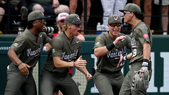 Vanderbilt left fielder Rustan Rigdon (19) celebrates with teammates after throwing out Georgia's Slate Alford at third base during the eighth inning of an NCAA college baseball game at Hawkins Field Saturday, April 19, 2025, in Nashville, Tenn.