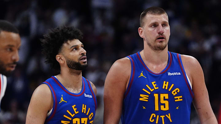 Apr 19, 2025; Denver, Colorado, USA; Denver Nuggets center Nikola Jokic (15) and Denver Nuggets guard Jamal Murray (27) during overtime against the LA Clippers at Ball Arena.