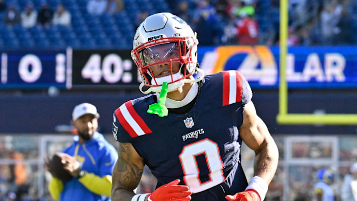 Nov 17, 2024; Foxborough, Massachusetts, USA;  New England Patriots cornerback Christian Gonzalez (0) warms up before a game against the Los Angeles Rams at Gillette Stadium. 