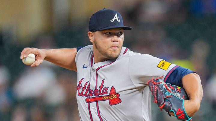 Aug 27, 2024; Minneapolis, Minnesota, USA; Atlanta Braves pitcher Joe Jiménez (77) pitches against the Minnesota Twins in the seventh inning at Target Field. Mandatory Credit: Brad Rempel-USA TODAY Sports