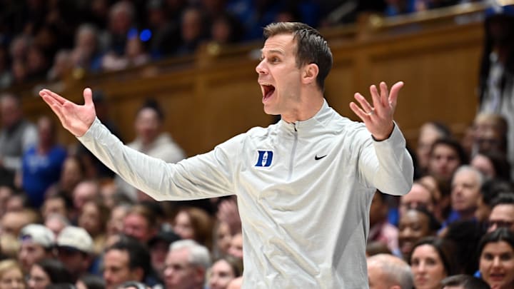 Dec 16, 2025; Durham, North Carolina, USA;  Duke Blue Devils head coach Jon Scheyer reacts during the second half against the Lipscomb Bisons at Cameron Indoor Stadium. Scheyer became the fastest coach to 100 wins in NCAA history.  The Blue Devils won 97-73.  Mandatory Credit: Rob Kinnan-Imagn Images