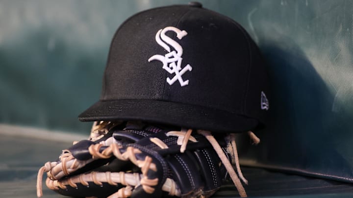 Jul 14, 2023; Atlanta, Georgia, USA; A detailed view of a Chicago White Sox hat and glove in the dugout against the Atlanta Braves in the fourth inning at Truist Park. Jul 14, 2023; Atlanta, Georgia, USA; A detailed view of a Chicago White Sox hat and glove in the dugout against the Atlanta Braves in the fourth inning at Truist Park.