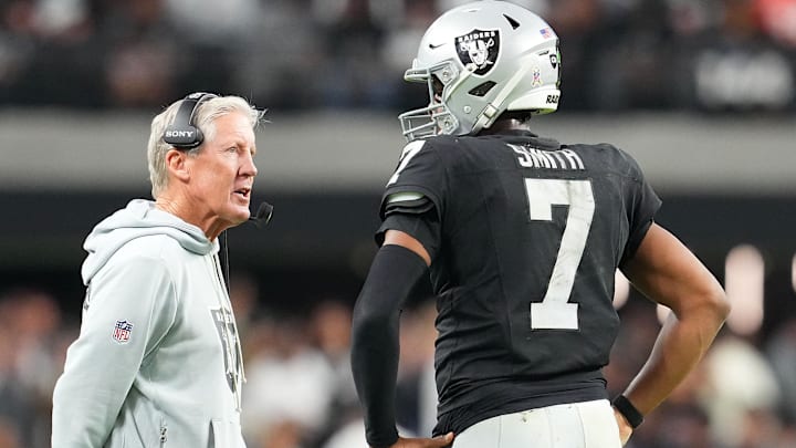 Nov 23, 2025; Paradise, Nevada, USA; Las Vegas Raiders quarterback Geno Smith (7) talks to head coach Pete Carroll in game against the Cleveland Browns during the fourth quarter at Allegiant Stadium. Mandatory Credit: Stephen R. Sylvanie-Imagn Images Nov 23, 2025; Paradise, Nevada, USA; Las Vegas Raiders quarterback Geno Smith (7) talks to head coach Pete Carroll in game against the Cleveland Browns during the fourth quarter at Allegiant Stadium. Mandatory Credit: Stephen R. Sylvanie-Imagn Images