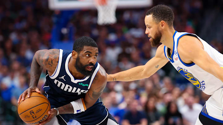 Apr 5, 2024; Dallas, Texas, USA;  Dallas Mavericks guard Kyrie Irving (11) looks to score as Golden State Warriors guard Stephen Curry (30) defends during the first half at American Airlines Center. Mandatory Credit: Kevin Jairaj-Imagn Images