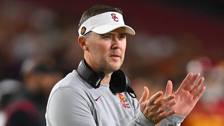Oct 1, 2022; Los Angeles, California, USA;  USC Trojans head coach Lincoln Riley applauds after a touchdown in the first half against the Arizona State Sun Devils at United Airlines Field at the Los Angeles Memorial Coliseum. Mandatory Credit: Jayne Kamin-Oncea-Imagn Images