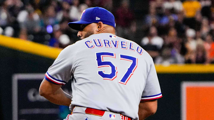 Sep 2, 2025; Phoenix, Arizona, USA; Texas Rangers pitcher Luis Curvelo (57) pitches in the sixth inning of the game between Arizona Diamondbacks and Texas Rangers at Chase Field. 