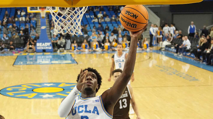 Nov 15, 2024; Los Angeles, California, USA; UCLA Bruins guard Eric Dailey Jr. (3) shoots the ball against Lehigh Mountain Hawks forward Hank Alvey (35) in the first half at Pauley Pavilion presented by Wescom. Mandatory Credit: Kirby Lee-Imagn Images