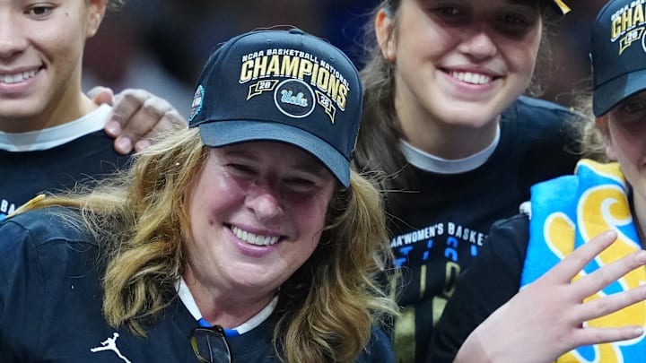 Apr 5, 2026; Phoenix, AZ, USA; UCLA Bruins head coach Cori Close celebrates with players on the podium after defeating the South Carolina Gamecocks during the National Championship game of the women's 2026 NCAA Tournament at Mortgage Matchup Center. Mandatory Credit: Kirby Lee-Imagn Images Apr 5, 2026; Phoenix, AZ, USA; UCLA Bruins head coach Cori Close celebrates with players on the podium after defeating the South Carolina Gamecocks during the National Championship game of the women's 2026 NCAA Tournament at Mortgage Matchup Center. Mandatory Credit: Kirby Lee-Imagn Images
