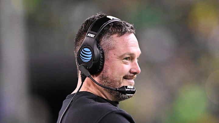 Dec 20, 2025; Eugene, OR, USA;  Oregon Ducks head coach Dan Lanning smiles during the third quarter against the James Madison Dukes at Autzen Stadium. Mandatory Credit: Craig Strobeck-Imagn Images
