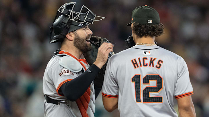 Aug 24, 2024; Seattle, Washington, USA; San Francisco Giants relief pitcher Jordan Hicks (12) meets at the mound with catcher at T-Mobile Park Aug 24, 2024; Seattle, Washington, USA; San Francisco Giants relief pitcher Jordan Hicks (12) meets at the mound with catcher at T-Mobile Park