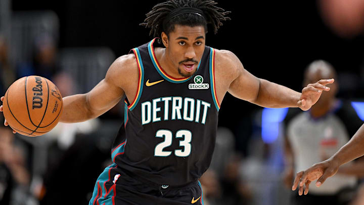 Jan 1, 2026; Detroit, Michigan, USA; Detroit Pistons guard Jaden Ivey (23) takes the ball up the court against the Miami Heat in the first quarter at Little Caesars Arena. Man