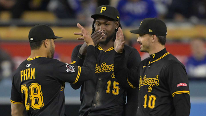 Pittsburgh Pirates left fielder Tommy Pham (28), center fielder Oneil Cruz (15) and right fielder Bryan Reynolds (10) shakes hands after the final out of the ninth inning defeating the Los Angeles Dodgers at Dodger Stadium on April 25.